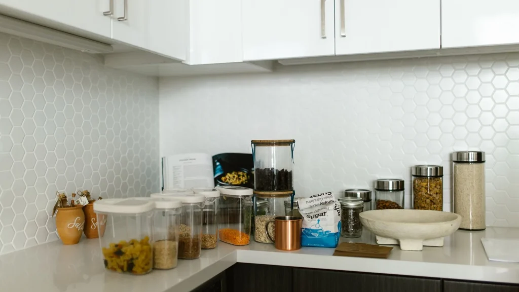 A neatly organized kitchen counter with various food storage containers. — selected for United States readers