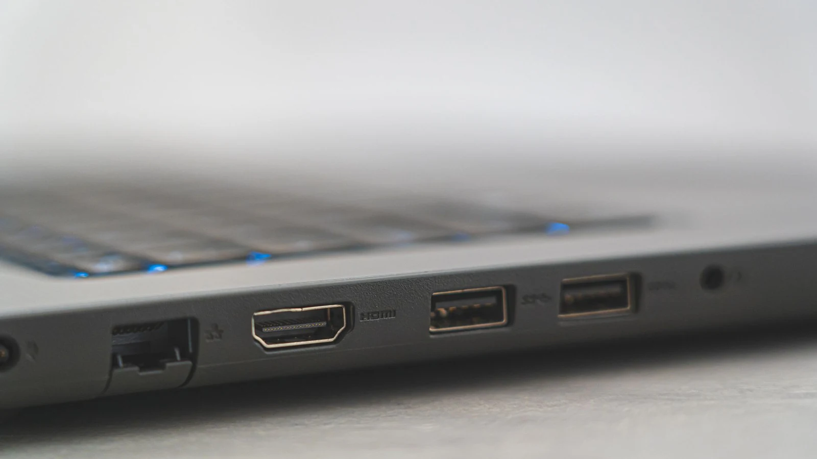 Detailed view of laptop ports including HDMI, USB, and Ethernet, showcasing connectivity options. — selected for United States readers