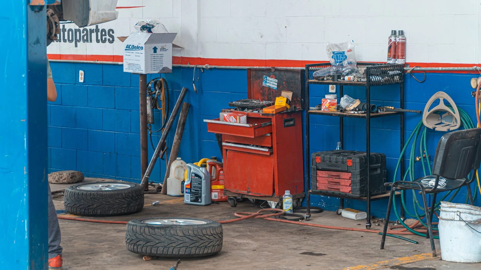 A detailed view of an auto repair garage interior showcasing tools and equipment. — selected for United Kingdom readers