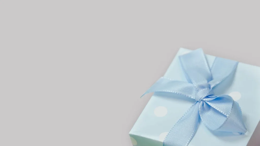 A close-up of a light blue gift box with a satin ribbon, perfect for celebrations. — selected for United Kingdom readers