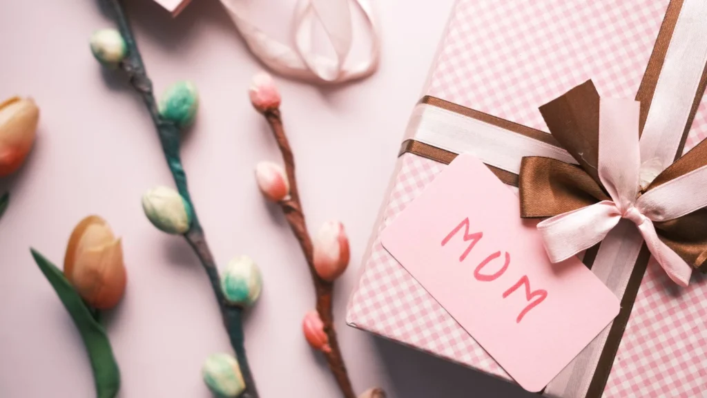 Elegant pink gift box with flowers and a 'Mom' card, perfect for Mother's Day celebrations. — selected for United Kingdom readers