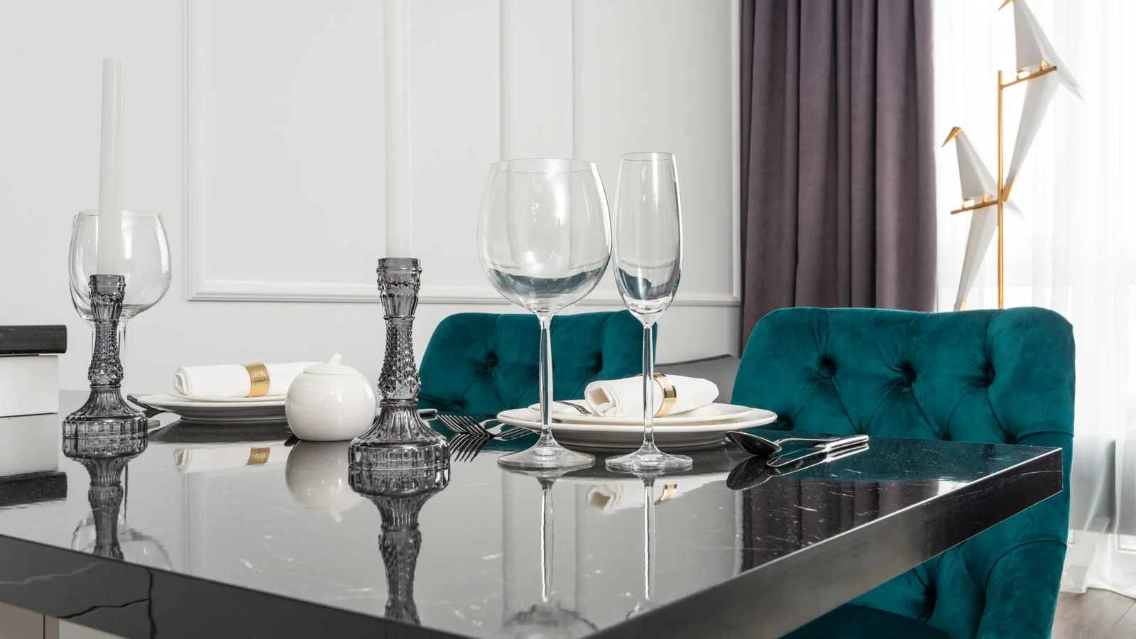 Chic dining room with green chairs, marble table, and elegant tableware setup. — selected for United Kingdom readers